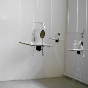 (Screenshot) Anna Fríða Jónsdóttir’s ‘Thought Interpreter’ ( 2012). Jars, bathroom tiles, spoons, 9 servo motors, arduino.
